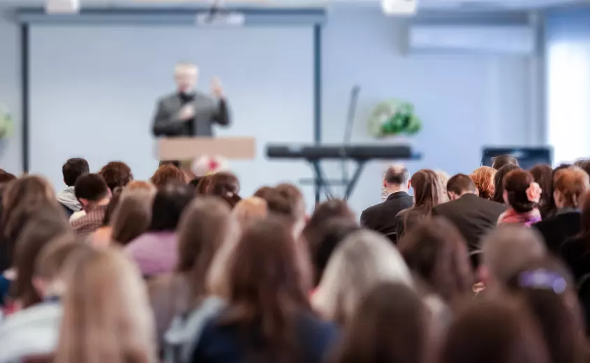 Person speaking to a crowd