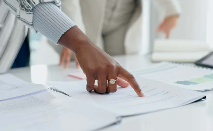 Hands reviewing a document