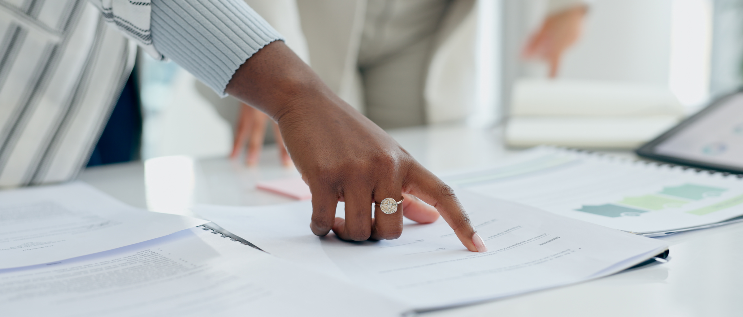 Hands reviewing a document