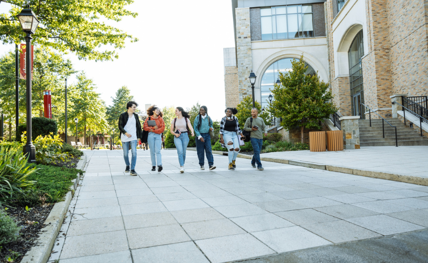 Group of students walking on campus.